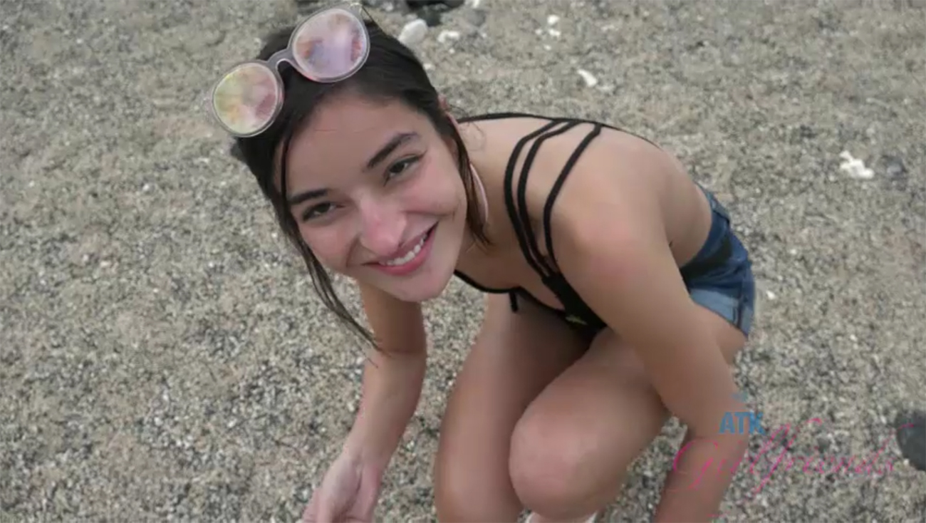 Emily enjoys the shoreline, and a sunset.